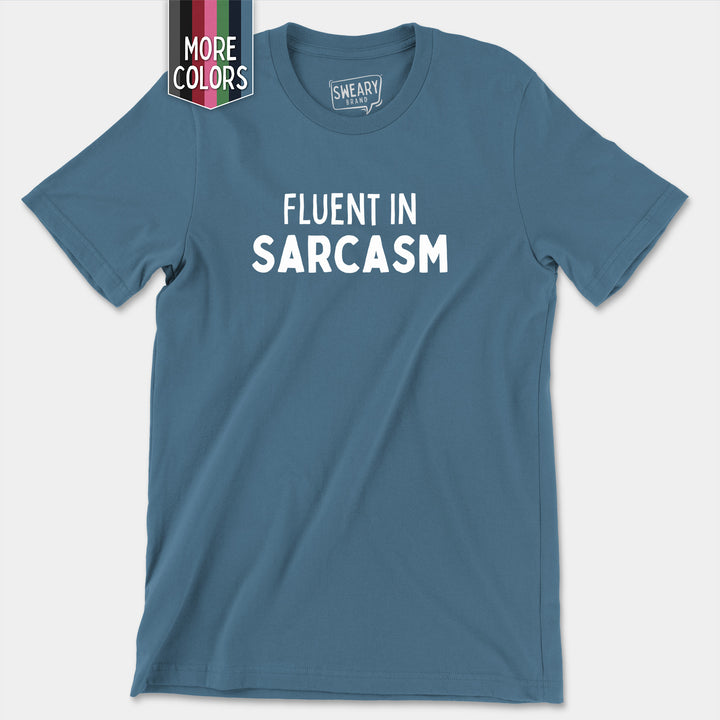 a blue t - shirt that says fluent in sarcasm