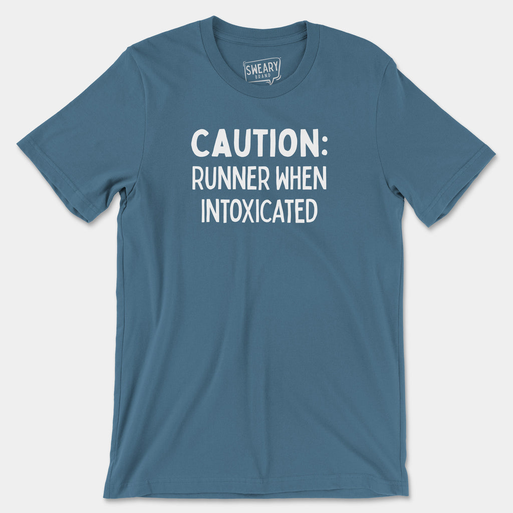 Steel Blue / S funny T-Shirt that says Caution: Runner When Intoxicated | Originals Edition Tee by Sweary Brand