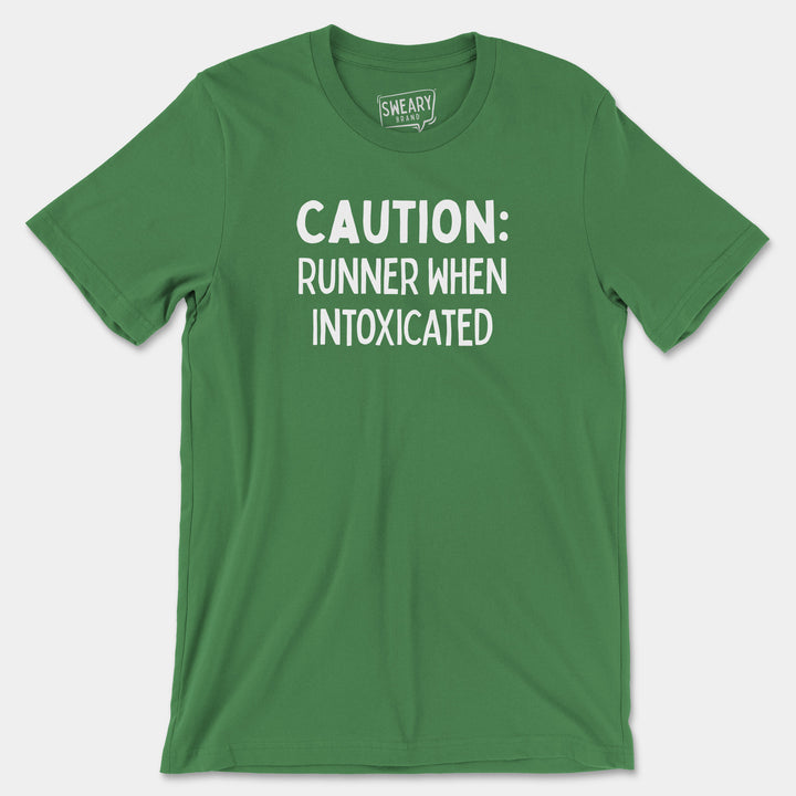 a green shirt that says caution runner when intoxicated