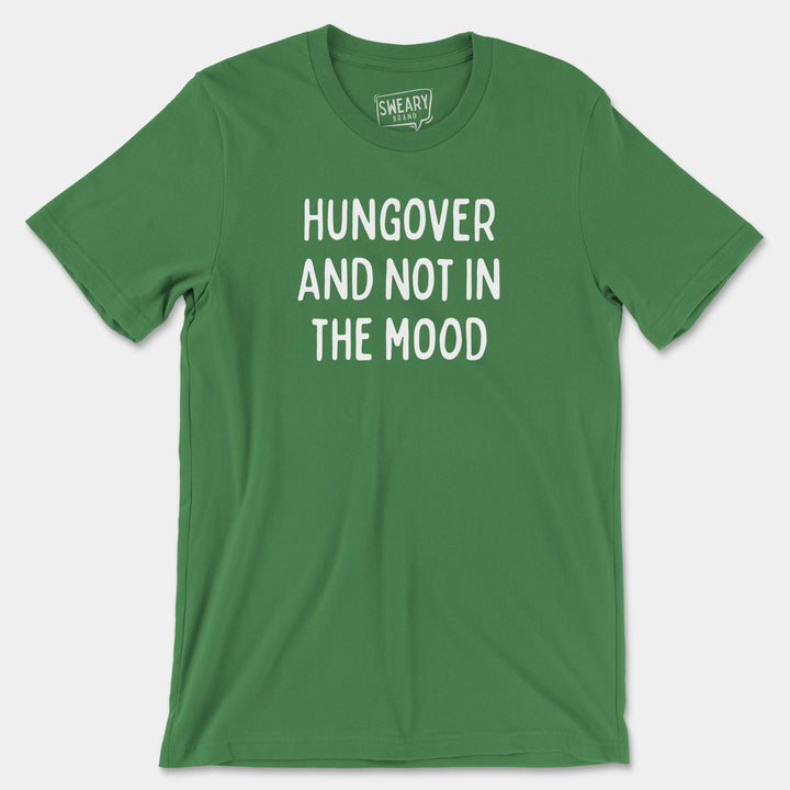 a green t - shirt that says hungover and not in the mood