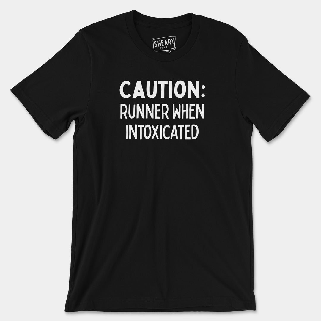 a black shirt that says caution runner when intoxicated